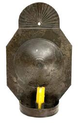 **SOLD** M238B 19th century hanging tin wall Sconce with wonderful rounded, fan-shaped, crimped and fluted top and deep convex circle on the back. Circa 1810 - 1820, very unusual size and form, finely folded edges, hole on back for hanging and a demilune dish holding a single rolled edge candle socket that is 1" tall.  Solder joints are secure. Sconce retains wonderful natural patina surface. Measurements: 7 &frac14;� wide x 2 5/8� deep x 11 &frac12;� tall. 
