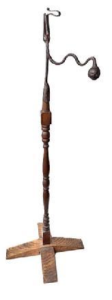 L227 Late 18th century to early 19th century hand forged wrought Iron Rush Light Holder on turned wooden floor stand. Unique design with scrolled top and heavy iron ball counterbalance on shaped arm. Exceptional surface patina. Approximate measurements: 46 &frac12;� tall x ~9� deep at ball counterbalance x ~18� across feet.  