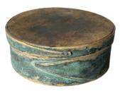 F27 19th century small painted finger lapped-seam pantry box bearing remnants of its robin egg blue painted surface.  American, round form with pine top and bottom and bent maple sides joined with opposing lapped fingers. Measurements are 7" diameter x 2 &frac34;� tall. 