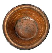 M212 18th century Pennsylvania Slip-Decorated Redware Bowl with lipped edge bearing beautiful deep reddish orange color with yellow slip decoration. The bottom is blackened from age and use. Visible hairline cracks and chips to interior surface. Measurements: 10� � 10 &frac14;� top diameter x 6 &frac12;� bottom diameter x 3 &frac12;�-3 5/8� tall, depending on where measured. 