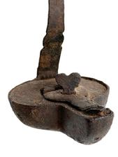 L408F Hand forged Iron hanging Betty Lamp / Whale / Fish Oil Lamp with hinged reservoir cover with heart-shaped locking finial, twisted iron spike hanger and internal wick support. Fantastic surface with evidence of hand forging / filing. Approximate measurements: 3� wide x 3 &frac12;� deep x 4 &frac34;� tall. Overall height is 13� tall with spike hanger.  