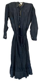 (i316) Late 19th century Woman�s Indigo Blue cotton dress with lined bodice and pearl buttons. This simple working dress shows extensive make-do repairs that were done with various indigo blue calico print fabrics � a true sign that this dress was used regularly, and for a long period of time. Circa 1860s-1880s. 