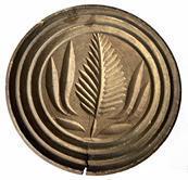 X265 19th century Chip-carved butter print of Pennsylvania origin, Butter Print has a very nice, deeply carved flower design. There is a small age crack from wood shrinkage. Measurements: 3 7/8� diameter x 2 &frac14;� tall   