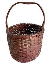 **SOLD** M46 Early oval shaped hand-woven splint gathering basket in its original dark barn red painted surface - featuring a double-wrapped double-rim with a notched, hand hewn steamed and bent handle. This is very nicely made, smaller sized basket in great condition. Approximate measurements: 10 &frac12;� x 7 &frac34;� x 6� tall sides. Overall height at handle is ~11�.  