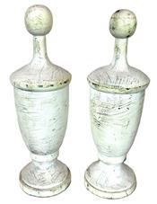 K1768 Pair of small size solid wooden architectural finials bearing several layers of white paint. Found in Pennsylvania. Each finial measures 3 &frac12;� bottom diameter x 11 &frac12;� tall.   