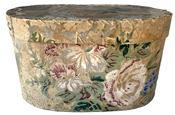 K132 19th century Philadelphia, Pennsylvania wallpaper Hat Box or Bandbox.  The outside of the oval pasteboard box bears remnants of wallpaper bearing a pastel floral pattern. The interior and bottom of this box is covered in newspaper dated 1858 from the Philadelphia, Pennsylvania area.  Measurements: 7 &frac12;� wide x 4 &frac12;� deep x 4 &frac14;� tall 