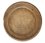 L512 Wooden plate with extensive wear on edges and "P" carved into the bottom of the slightly raised foot. Natural patina surface. Out of round. Measurements: 7 &frac14;� x 7" diameter x ~ &frac14;� - ~ &frac12;� tall, depending on where measured.   