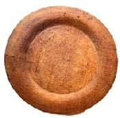 L512 Wooden plate with extensive wear on edges and "P" carved into the bottom of the slightly raised foot. Natural patina surface. Out of round.  Measurements: 7 &frac14;� x 7" diameter x ~ &frac14;� - ~ &frac12;� tall, depending on where measured.   