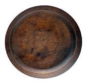 RM1610 Wooden treenware plate bearing very scant remnants of an incised ring on outer edge and slightly raised, hand hewn footed base bearing the initials "LS" carved into the bottom. Exceptional wear, chop marks and patina created by time and extensive use. Slightly out of round, measuring 7� x 7&frac14;� diameter x ~ &frac14;� thick.