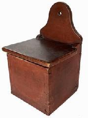**SOLD** B637 Early 19th century Pennsylvania Salt Box with the original red paint. Dovetailed case featuring an arched back with hole for hanging. The wood is walnut. Circa 1820.  Measurements: 12 1/4" tall x 8" wide x 7 1/2" deep