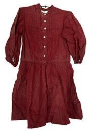 (i308) Mid-19th century Child�s Turkey Red cotton dress with pearl buttons. Children�s clothing was made with additional tucks that could be let out as the child grew. The fading at the tuck seams of this example provides evidence this dress was used for a long period of time as several tucks have been let out and show various degrees of fading. There is extensive deterioration of the fabric � which is common with Turkey Red prints - due to ingredients used in the dye process to create the distinctive color. Circa 1850s-1860s.  