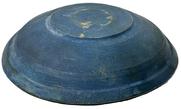 M1149 Early 19th century lathe turned wooden bowl with original old dark blue paint inside and outside featuring a lipped rim and slow turned lathe marks throughout � resting on a footed base with hand hewn center. Out of round. No cracks. Measurements: 6 5/8" x 7" top diameter x ~1 &frac12;� x ~1 5/8" deep, depending on where measured. Footed base is 3" x 3 &frac14;� diameter. 