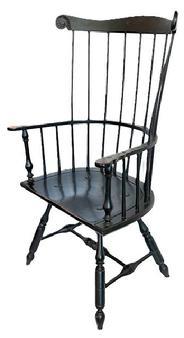 L217 Philadelphia-style bench made Comb-Back Windsor Armchair in original black painted surface.  This sturdy bench made Windsor features a tall, stately back with nine straight spindles topped with a crest rail boasting carved �ears� and rests on graceful turnings on the stretcher and legs � which are mortised through the broad, D-shaped seat.  Measurements: 28� across front of arms x 17 &frac12;� deep seat x 46� tall back. The seat measures 18 &frac14;� tall from floor.  