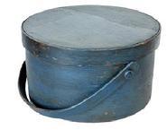 L97 Early 19th century New England wooden bail handle Pantry Box bearing the original dark blue painted surface. Heavy construction with tacked lap joints and a bentwood swing handle that is secured with wooden pegs. Clean, natural patina interior with the name �May Swanson� written on tape inside the lid.