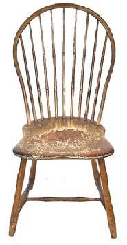 L122 19th century Pennsylvania Bow Back Windsor chair with nine spindle back and bamboo turnings in old mustard paint over original red painted surface. Great wear from years of use.  Measurements: 17� wide across front of seat x 16 &frac14;� deep seat x 36 &frac12;� tall back. The seat is 16 &frac12;� tall. 