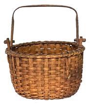 **SOLD** M57 19th century sturdy hand-woven thick oak splint swing handle Basket from Pennsylvania. Nicely woven with a single wrapped, double rim with notched posts that secure the squared, hand-hewn swing handle to the basket with wooden pegs. Slightly rounded bottom is heavily reinforced and boasts a slightly bumped up interior for weight distribution and air flow. Measurements:12 &frac14;� x 11 &frac34;� diameter. The sides are 7 &frac34;� tall. Approximately 14� tall with handle up. 