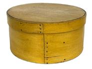 L412 19th century New England Pantry Box with beautiful original dry mustard painted surface and clean, natural patina interior. Steamed and bentwood construction with overlapping sides being secured with small tacks. Clean, sturdy box with tight fitting lid. Measurements: 10� diameter (top) x 9 &frac34;� diameter (bottom) x 5� tall.  