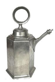 L268A Large six-sided pewter wine container with threaded lid with ring for carrying, and threaded spout cover. Engraved �HC.SHB� on side and bears maker�s stamp on bottom �R-B�. Very heavy. This is a typical style of wine vessel used in the 18th century and was also known as a �Prismenkanne� or �Zinnkanne�. Approximate measurements: ~7 &frac34;� across widest point on bottom x ~11� deep to tip of finial on spout lid x ~15 &frac12;� tall including ring on lid. 