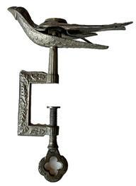 K1705 19th century American Sewing Bird Clamp with original surface boasting prominent stamping that reads �Patented� on the bird�s right wing, and �Feb 15, 1853� on bird�s left wing.  All mechanics are in good working condition and the beak clamps tightly. This is a great example of the first sewing bird patent that was granted to Charles Waterman of Meriden, Connecticut on February 15, 1853 � and was by far the most popular style � often called the �Waterman Bird� after its creator. This style of highly decorated sewing bird was considered a status symbol indicating wealth. It was also a treasured token young men would give to their betrothed prior to their wedding as a reminder of her future husband while she prepared her wedding trousseau and sewed items for the future household.  Approximate measurements: 3 &frac12;� long (beak to tip of tail) x 2� wide x 5� tall. 