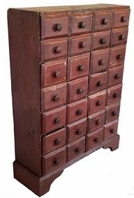 G118 19th century Pennsylvania red painted tall Apothecary Chest with twenty-eight drawers, the drawers are nailed construction, and rest on an applied base, with a nice high cut out apron. The drawer fronts are chamfered.  The overlapping drawer fronts act as a drawer stop. Circa 1880. Measurements are: 31 &frac12;� wide x 11� tall x 42� tall. 