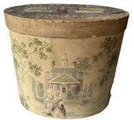 K1570 Exceptional mid-19th century Pennsylvania identified and dated Wallpaper hatbox / bandbox with wallpaper covered exterior depicting a large estate with people enjoying the gardens and playing yard games.  A very detailed hand-painted scene of St. Paul Academy for Girls on the top of the lid. Writing below the scene reads: �RESIDENCE OF ST. PAUL ACADEMY FOR GIRLS   NO. 26 ARCH ST. SCRANTON PA   MADE BY ELIZA FAIRMAN  HER 2ND YEAR 1858� The clean interior is lined with pages of �The Scranton Republican� (Scranton, Pennsylvania) newspaper dated January 21, 1858. A photograph of a well-dressed woman with �Love, Mother� handwritten on the front is attached to the interior center of the lid and surrounded with a make-shift medallion with delicate, handsewn silk pansy blossoms attached to three of the corners. Several clippings of drawings/prints are also found attached inside the box. Well preserved in great condition!  Measurements:  14 &frac14;� x 11 1/8� oval x 12 &frac14;� tall.  