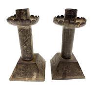 RM1594 Unique early pair of handmade tin candlesticks with embossed decorations and tapered, square weighted bases.  Embossed diagonal lines adorn the center stems, embossed floral decorations adorn the bases and each drip cup is surrounded with a scalloped edge. Rolled edges with tight soldering joints throughout. Measurements: Bases are 2 &frac34;� square and overall height of each one is 5 &frac14;� tall