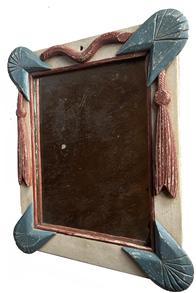 K1546 Late 19th century patriotic Folk Art decorated wooden framed mirror boasting red, white and blue painted frame with applied wooden rope and tassels. Original glass retaining nice silvering held in place with original wooden back. Bottom left corner broken off thick glass mirror � however it does not interfere with integrity of the piece. Approximate measurements at widest / tallest points:  14� wide x ~1 &frac34;� thick x 16 &frac14;� tall. 