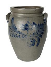 K165 19th century cobalt blue decorated 2-Gallon Stoneware Crock attributed to Peter Hermann (1825-1901) of Baltimore, Maryland. Ovoid shape with tooled shoulder, grooved collar with squared rim and applied lug handles. Prominently stamped �2� beneath one of the handles. Fantastic hand brushed Cobalt flowers and leaves encircle the crock along the shoulder. Circa 1840s-1860s. Hairlines to bottom and minor chips along the rim. Measurements: 6 5/8� diameter (bottom) x 8 &frac12;� diameter (top) x 12� tall   