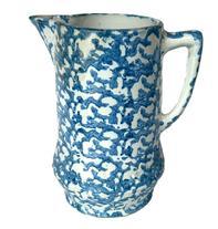 L331 19th century blue and white Spongeware pitcher boasting the classic sponge-applied blue speckled pattern on durable white stoneware.  A banded embossed/impression of double diamond patterns encircles the bulbous base. Handle and spout are in good condition. Measurements: The footed base measures 4 &frac34;� diameter. Overall height is ~9� tall.  