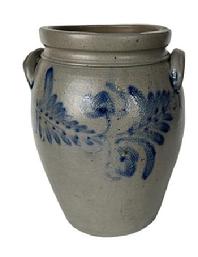 K165 19th century cobalt blue decorated 2-Gallon Stoneware Crock attributed to Peter Hermann (1825-1901) of Baltimore, Maryland. Ovoid shape with tooled shoulder, grooved collar with squared rim and applied lug handles. Prominently stamped �2� beneath one of the handles. Fantastic hand brushed Cobalt flowers and leaves encircle the crock along the shoulder. Circa 1840s-1860s. Hairlines to bottom and minor chips along the rim. Measurements: 6 5/8� diameter (bottom) x 8 &frac12;� diameter (top) x 12� tall. 