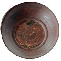 L142 Early 19th century hand turned wooden bowl bearing red over original red painted surface with prominently lipped rim and evidence of slow lathe turnings throughout. Bowl rests on a slightly footed base and retains great natural patina interior with wear indicative of years of use. Out of round. Measurements:  9 &frac34;� x 10� diameter x 2 &frac12;� � 2 &frac34;� tall (depending on where measured). 