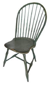 L123 Late 18th century Pennsylvania Bow Back Windsor chair with nine spindle back and bamboo turnings in old Windsor green painted surface. Great wear from years of use.  Measurements: 15 1/2" wide across front of seat x 16" deep seat x 36 1/2" tall back. The seat is 17" tall. 