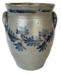 **SOLD** K164 19th century cobalt blue decorated Stoneware Crock attributed to Remmey of Philadelphia, PA. Ovoid shape with tooled shoulder, decorated flared collar with squared rim and applied lug handles. Fantastic hand brushed Cobalt fan-shaped flowers and leaves encircle the crock along the shoulder. Circa 1840s-1860s. Hairlines to bottom.  Measurements: 6 5/8� diameter (bottom) x 8 &frac12;� diameter (top) x 12� tall   