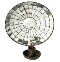 L234 19th century hanging tin wall sconce with round mirrored back and fluted edge drip cup. Nicely rolled edges with secure solder joints. Measurements: Mirrored area measures 7 &frac34;� x 8�. Overall height is 8 5/8� tall and the outer front edge of the drip cup extends 4 &frac34;� from the wall when hanging.   