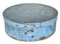 L364 19th century New England pantry box with opposing finger laps Pantry Box with beautiful dry blue painted surface over the original green paint. Steamed and bentwood tiny wooden pegged construction with opposing finger laps being secured with tiny square head nails and tacks. Clean, natural patina interior. Measurements: 8 &frac14;� diameter x 2 &frac34;� tall.  
