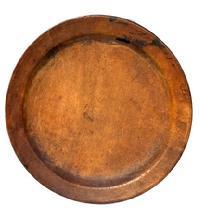 L407A Early wooden plate - with initials and symbols carved into the bottom. Nice patina and wear indicative of use. Out of round. Measurements: 7 3/8" x 7 &frac34;� diameter x &frac12;� deep.  