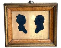 **SOLD** M211 Exceptional 18th century identified Pennsylvania framed hollow-cut silhouettes of a woman and a man facing each other against a black background. The name �Hugh Wilson� is written in pencil below the man. The birds eye maple frame with gold gild accents and an early ring intact on top for hanging purposes all appear to be original.  In this type of silhouette, the profile was cut out and discarded. The remaining surrounding paper was then placed against black paper or silk fabric to prominently reveal the wonderful profile. Circa 1790 � 1810. Framed measurements: 7 5/8� wide x 1� thick x 6 3/8� tall. 