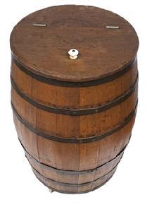 L350 Late 19th century Country Store Barrel with hinged lid retaining original porcelain knob. Natural patina surface, with no evidence of ever being painted. Vertical steamed and bent wooden staved construction secured with six horizontal iron bands. Original porcelain casters remain intact on bottom. Circa 1870s-1890s. Measurements: 15 &frac12;� top diameter x 26 &frac12;� tall.   