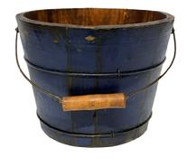 M1145 19th century original blue painted bucket from Pennsylvania with arched wire bail handle and turned wooden grip. The interior is old natural patina. Tongue and grooved staved construction held in place with thick wire bands. Measurements: 9 &frac34;� x 10 1/8� top diameter x 7 &frac34;� bottom diameter x 7 &frac12;� tall (not including handle). 