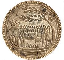 K55 19th century chip-carved butter print stamp of Pennsylvania origin boasting a deeply carved Cow design. There is a small age crack from wood shrinkage.  Very dry, natural patina surface. Measurements:  3� tall x 4 5/8� diameter 