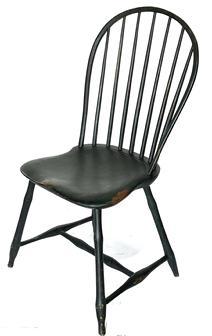 L65 Late 18th century to early 19th century New England, seven spindle bow back Windsor Chair bearing old black over original Windsor green painted surface. Sturdy shaped plank seat rests on splayed bamboo-style turned legs. Measurements:  Seat is 16 &frac14;� deep x 16 &frac12;� tall. Back is 18� wide x 35 &frac34;� tall. 