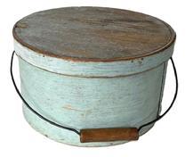 L245 Early 19th century New England bail handle pantry box retaining its original light blue painted surface. Heavy construction with overlapping steamed and bentwood sides secured by small tacks.  The sides of the pantry box are fitted with a pair of oval stamped tin handle mounts that secure an arched wire swing handle with wooden hand grip with great patina from years of use. Interior retains its natural patina surface. Measurements: 11 &frac34;� diameter x 6 3/8� tall. 