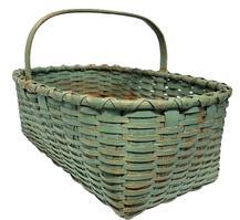 M236 Rectangular gathering basket in original robin egg blue paint. Extremely sturdy woven basket boasts double steamed and bent rims that are double wrapped and a thick, steamed and bent handle that is notched and woven into the sides of the basket.  The bottom of the basket features 1 &frac14;�- 1 &frac12;� wide woven slats. Measurements: 23" long x 16" wide x 8 &frac12;� tall sides (approx. 13 &frac12;� tall at handle).  