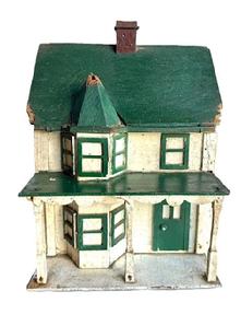 L310 Folk Art Bird House bearing its original green, white and Spanish red painted surface. It has two chimneys and a lot of character with the front bump out with hexagonal roof, overhanging porch with scalloped trim and individual posts, and applied windows and doors. The wood is pine with small wire nail construction.  Early to mid-20th Century.  Measurements are: ~17 &frac14;� deep x ~ 10 &frac14;� wide x ~15� tall.