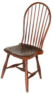 H194A  Late 18th to early 19th century Bow-Back  Windsor Chair retaining its original bittersweet red painted surface with seven spindle back raised on slightly splayed legs joined by an H-form stretcher. Nice, solid condition with great wear indicative of age. Circa 1790 � 1810. Measurements: 16� deep x 15 &frac34;� wide x 38 &frac12;� tall (back) x 17� tall (seat front) 