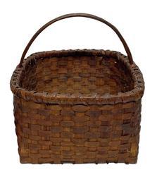 K192 Skillfully made heavy hand-woven natural Splint Oak basket with a squared, double wrapped, double wooden rimmed top that tapers slightly to a squared bottom.  There are a few very minor losses due to age and use, but they do not affect the integrity of this sturdy basket.  Measurements:  13 &frac12;� x 15� across opening. The sides are 8� tall. Overall height is 14� tall to top of handle.  