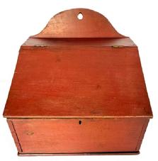 M52 Large 19th century Lancaster County, Pennsylvania Wall Box with hinged lid and arched tombstone back in original red painted surface. The wood appears to be poplar with dovetailed case with square head nail construction and hole in top for hanging purposes. Circa 1820s-1830s. Measurements: 13 &frac14;� wide x 11 &frac14;� deep x 5 &frac34;� tall (front) x 11 &frac12;� tall (back)