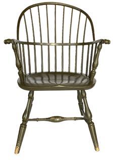 E49 Philadelphia Windsor �Sack-back Windsor armchair with finely turned vase shaped legs joined by bulbous-turned �H� stretchers. The slightly dished seat supports a back of nine spindles in the bow and 15 spindles and two turned posts below the medial bow with carved knuckle arms. Pressure branded under seat: F. TRUMBLE� for Philadelphia Windsor chairmaker working late 18th and early 19th century