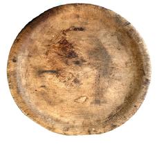 **SOLD** M20 Nice early wooden treenware carved dish / plate bearing natural patina surface with great wear and evidence of heavy use on both sides. Unmarked. Measurements: ~9 &frac12;� x 9 &frac34;� diameter x ~1" thick.  