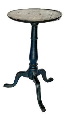 L11 Fantastic 18th century Mid-Atlantic Chippendale painted pine candlestand featuring a carved dish-rim around the top, turned pedestal and arched tripod snake legs retaining a wonderful original old blue painted surface. The legs are dovetailed into the center column. The wood is yellow pine. Great wear to top indicating years of use. Measurements: 15 &frac12;� diameter top x 27� tall. 